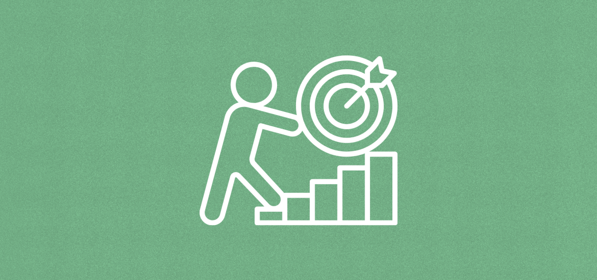 Stick Figure pushing goals target up a bar chart